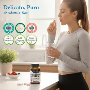 Magnesio bisglicinato migliorato 500mg, senza nulla di artificiale, 100 capsule vegane Una donna assume una capsula con un bicchiere d'acqua accanto al flacone di magnesio glicinato.