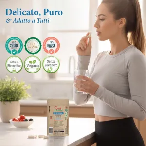 Magnesio bisglicinato migliorato 500mg, senza nulla di artificiale, 100 capsule vegane, confezione ecologica Una donna assume una capsula con un bicchiere d'acqua accanto alla confezione di magnesio.
